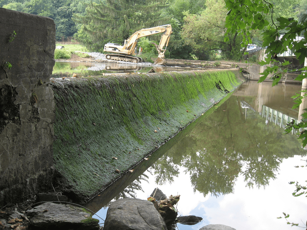a dam with construction machinery